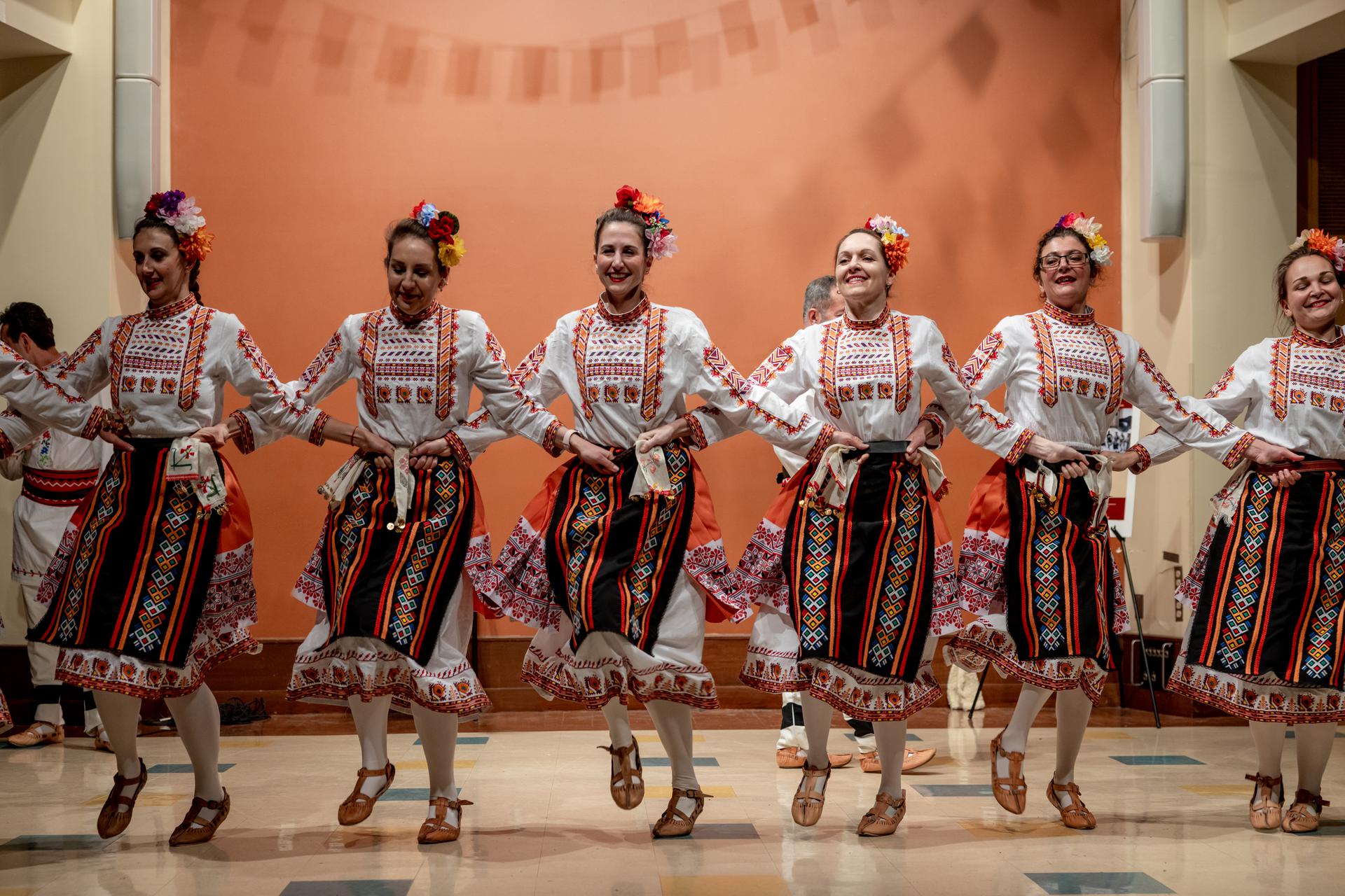 Students dancing in traditional outfits