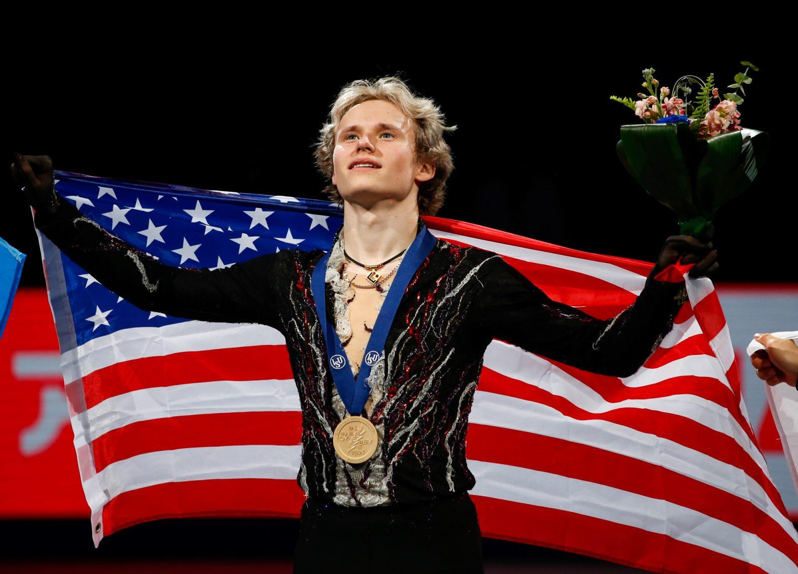Men’s gold medal winner Ilia Malinin of the USA poses with an American flag after the competition. SARAH CRUZ/DFP PHOTOGRAPHER 
