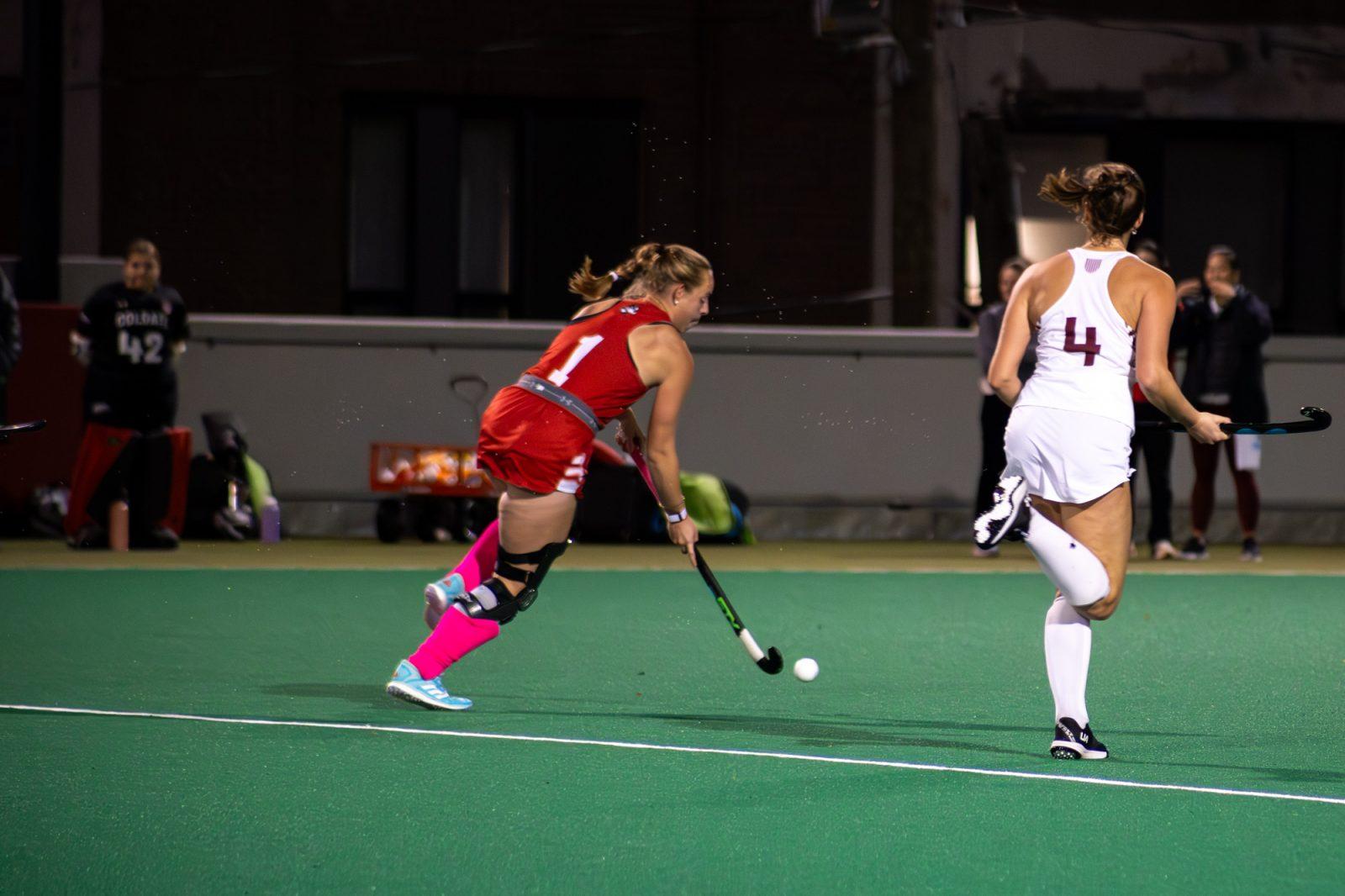 Junior midfielder Maddie Hudson (1) carries the ball down the field during a field hockey game on Oct. 19. The Boston University field hockey team lost its final regular season game against Cornell University on Sunday. HOLLY GUSTAVSEN/DFP PHOTOGRAPHER
