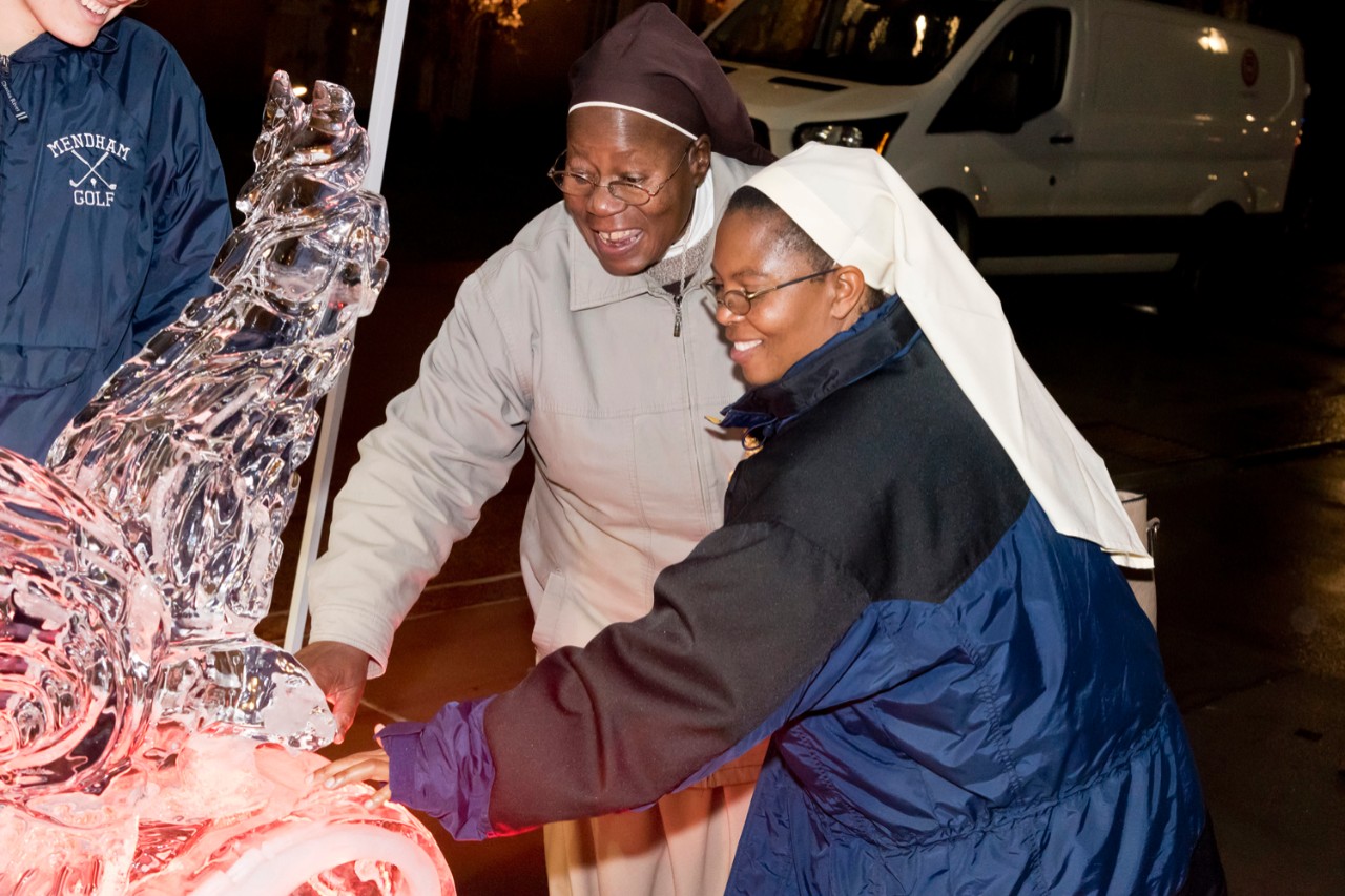 Women religious check out the ice sculpture. Women religious check out the ice sculpture.