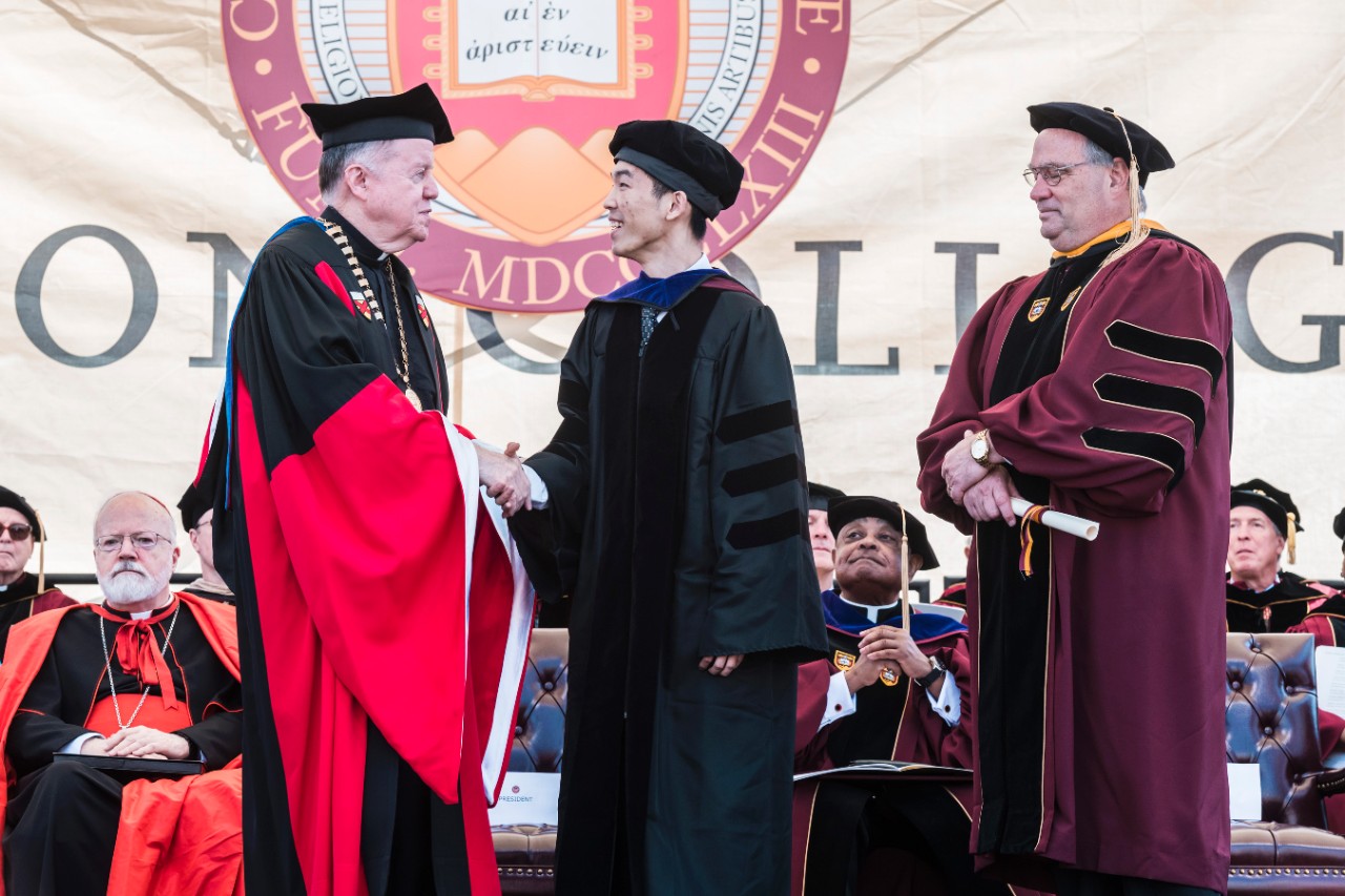 Student receives diploma Student receives diploma