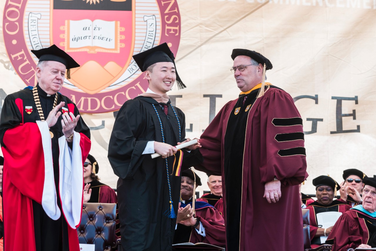 Student receives diploma Student receives diploma
