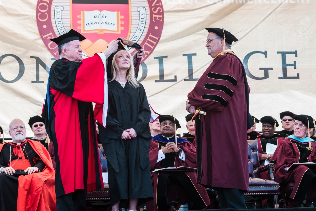 Student receives diploma Student receives diploma