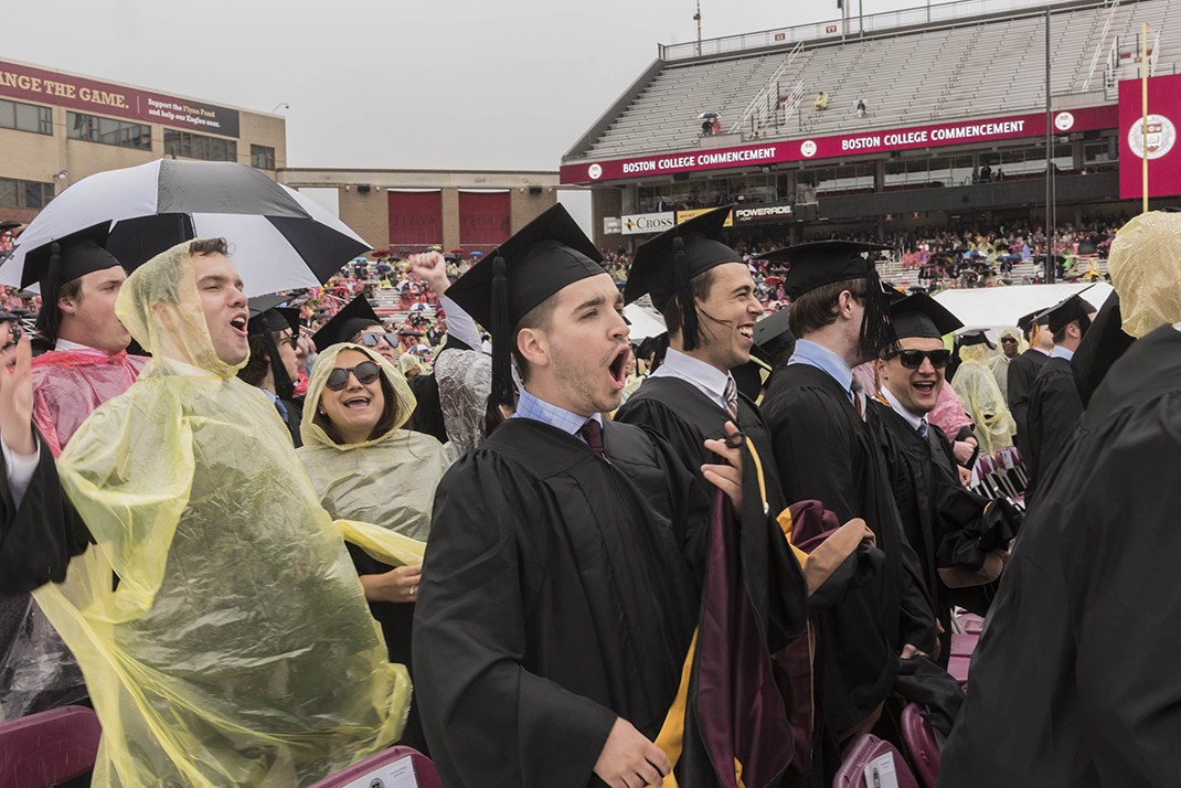 Scene from Alumni Stadium at BC Commencement; umbrellas and students in rain ponchos Scene from Alumni Stadium at BC Commencement; umbrellas and students in rain ponchos