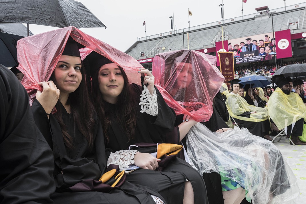 Scene from Alumni Stadium at BC Commencement; umbrellas and students in rain ponchos Scene from Alumni Stadium at BC Commencement; umbrellas and students in rain ponchos