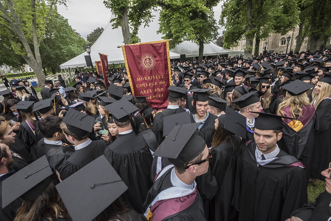 The graduating class gathered on Linden Lane before processing to the main Commencement ceremony in Alumni Stadium. The graduating class gathered on Linden Lane before processing to the main Commencement ceremony in Alumni Stadium.