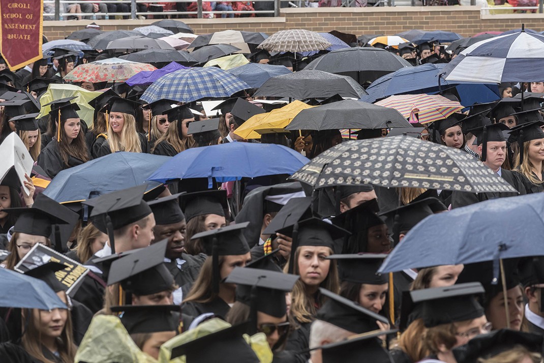 Scene from Alumni Stadium at BC Commencement; umbrellas Scene from Alumni Stadium at BC Commencement; umbrellas