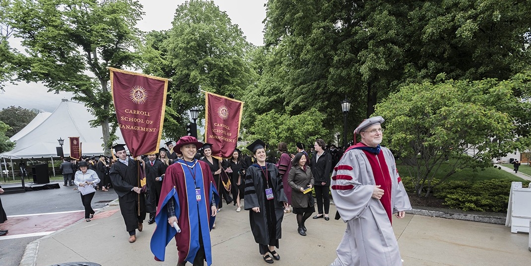 The graduating class gathered on Linden Lane before processing to the main Commencement ceremony in Alumni Stadium. The graduating class gathered on Linden Lane before processing to the main Commencement ceremony in Alumni Stadium.