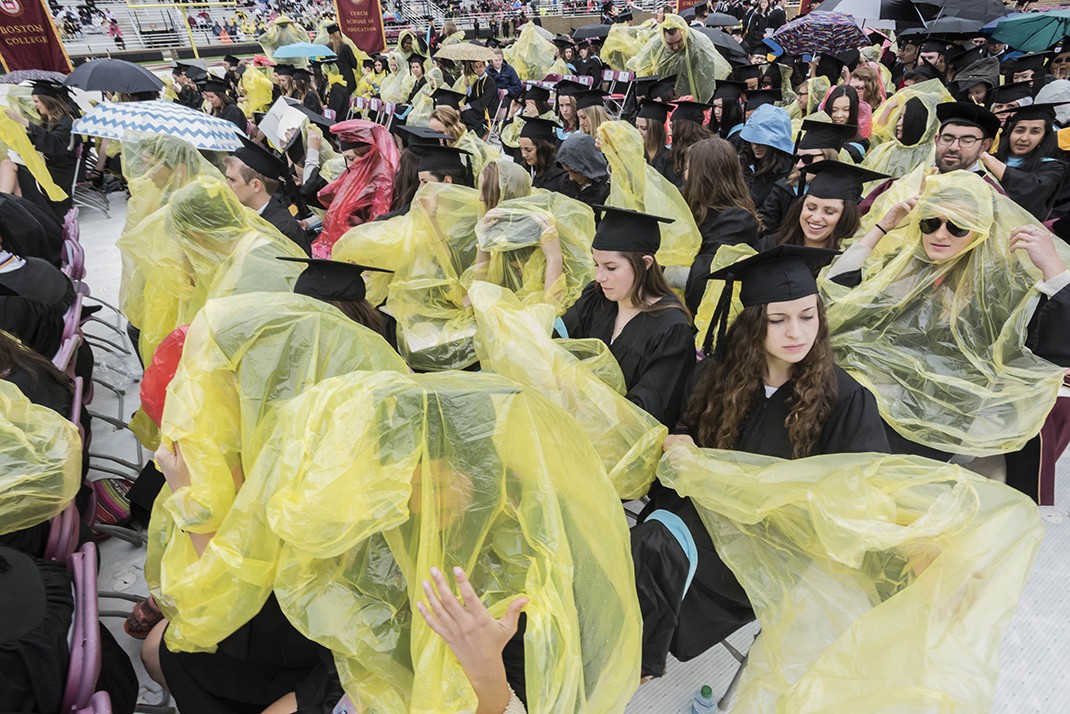Scene from Alumni Stadium at BC Commencement; umbrellas and students in rain ponchos Scene from Alumni Stadium at BC Commencement; umbrellas and students in rain ponchos