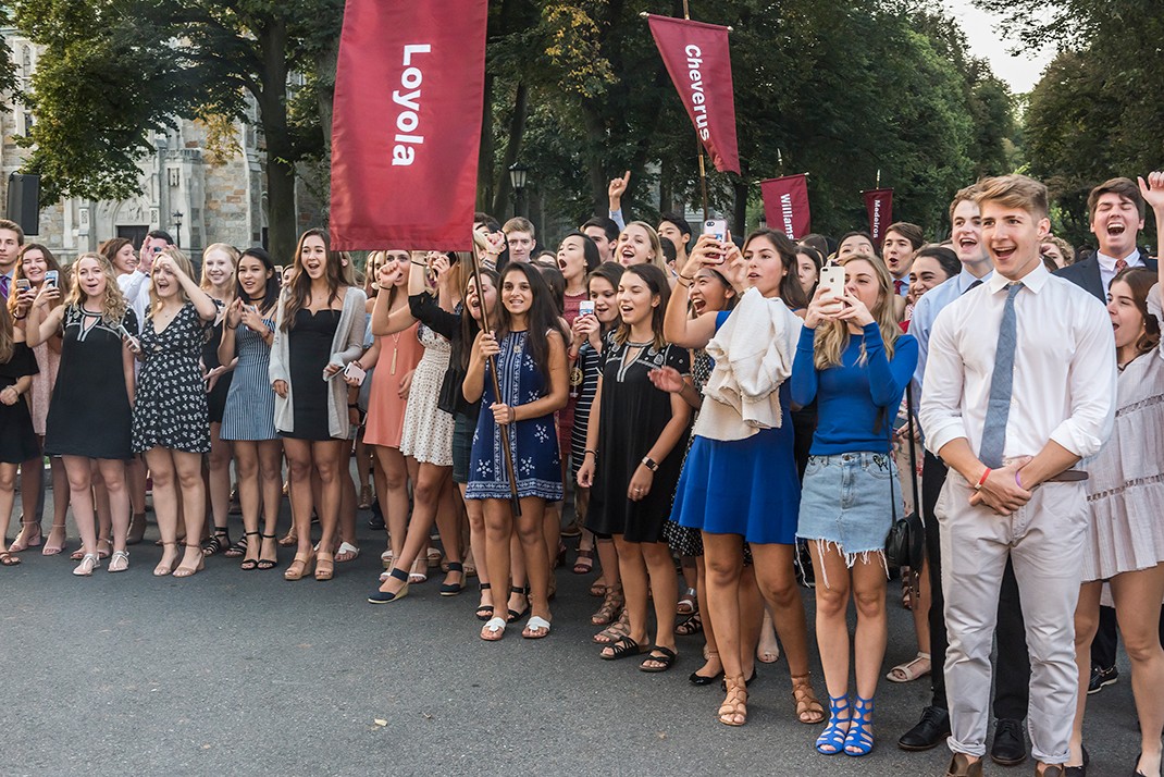 Assembled on Linden Lane, students hear faculty, staff, and administrators challenge the class to "Go set the world aflame.' Assembled on Linden Lane, students hear faculty, staff, and administrators challenge the class to "Go set the world aflame.'