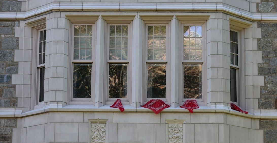 Red bandannas beneath windows at BC Red bandannas beneath windows at BC