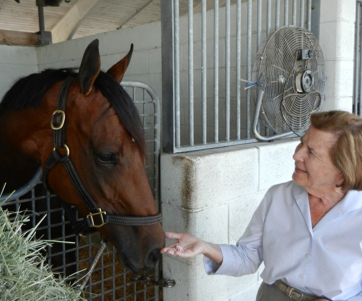 Mrs. Robsham with one of her beloved horses.