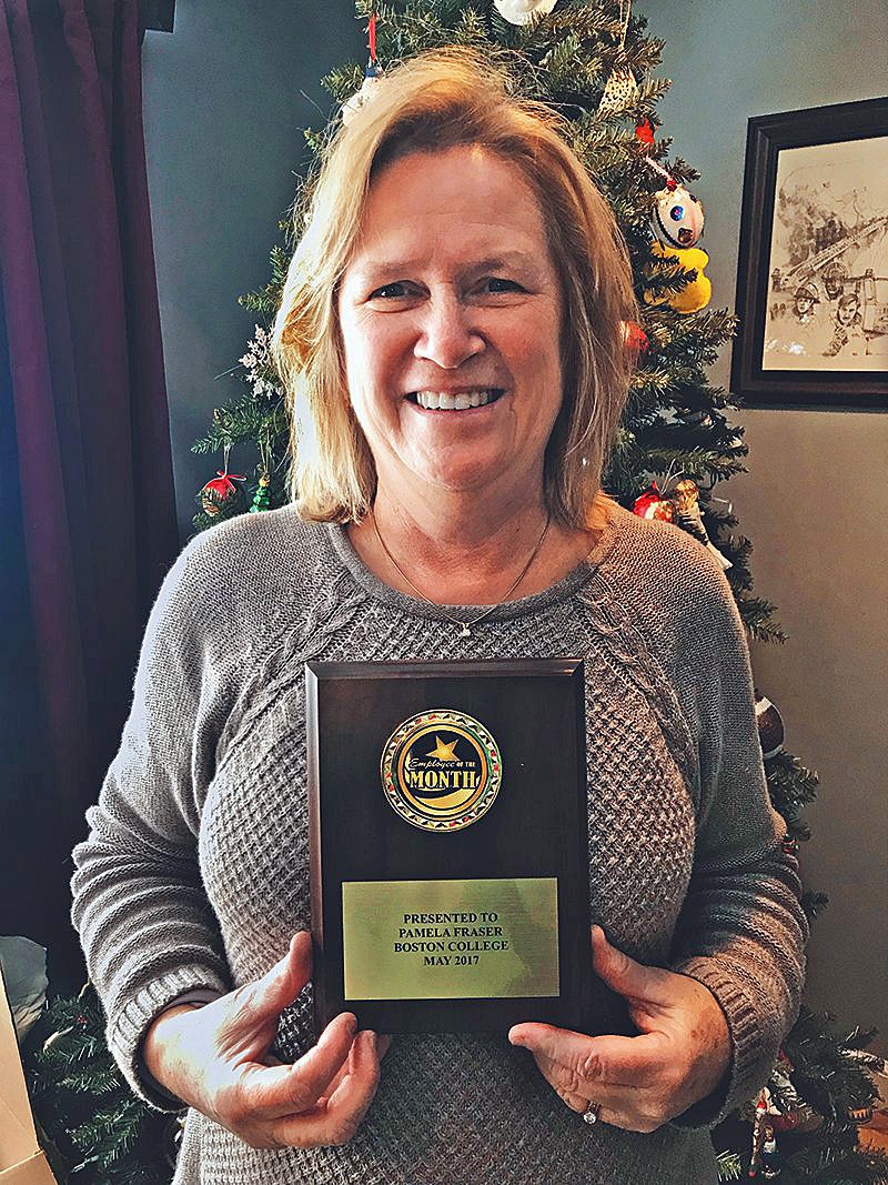 Pamela Fraser holding a plaque