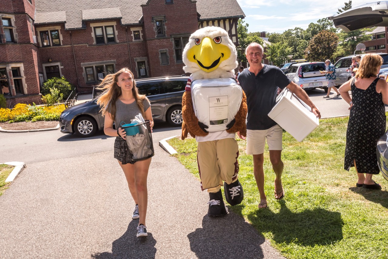 Baldwin, here with Elyse Messick '21 and her dad, Chip, pitches in on Upper Campus. Baldwin, here with Elyse Messick '21 and her dad, Chip, pitches in on Upper Campus.