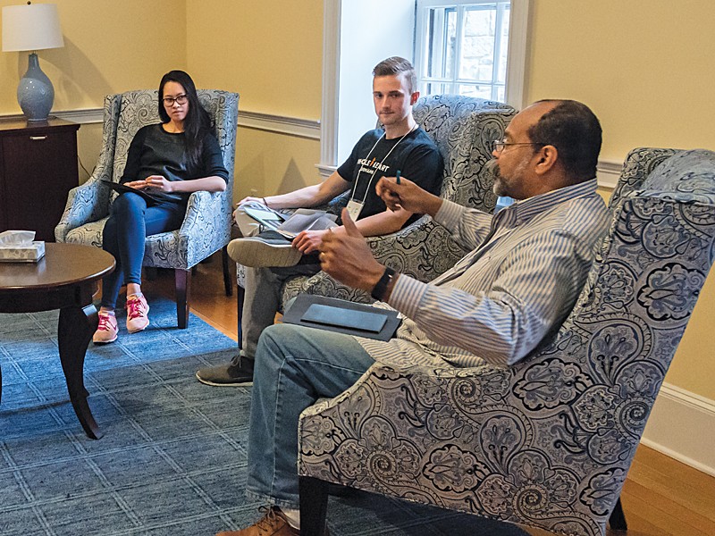 Bill Tibbs in conversation with his small group