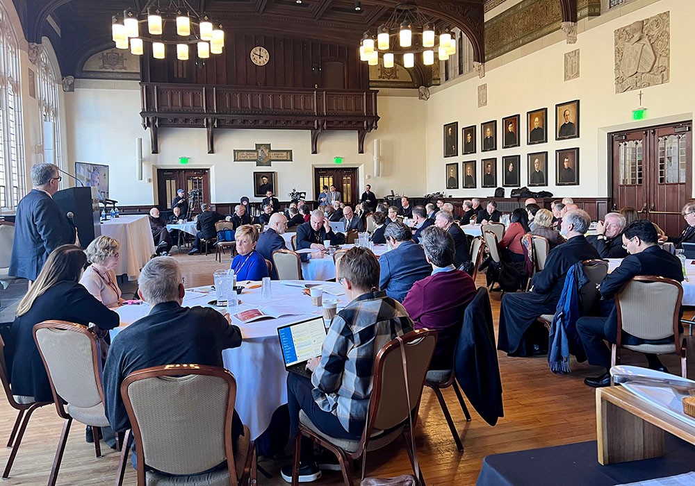 Attendees at the conference seated at round tables