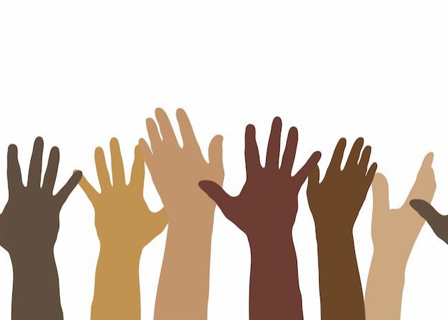Image of raised hands in various skin colors