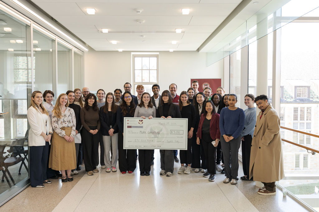 ESC 2025 group photo with winning check. 