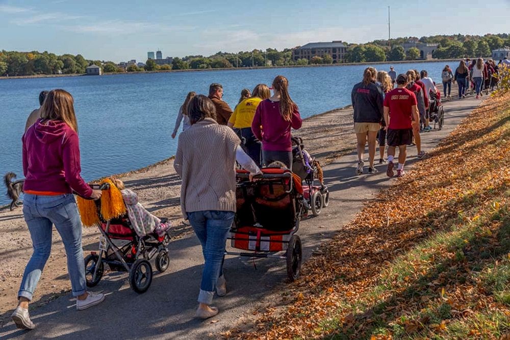 A group of people walking around the Reservoir