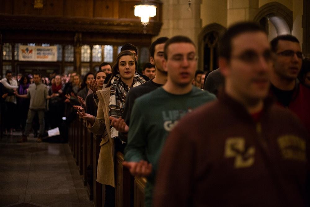 A group of people standing in church