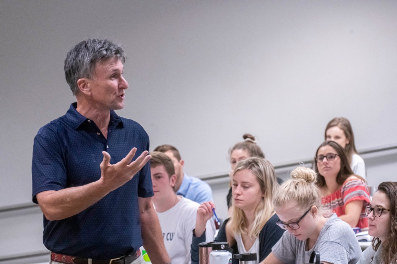 Ed Taylor teaching to a lecture hall of students