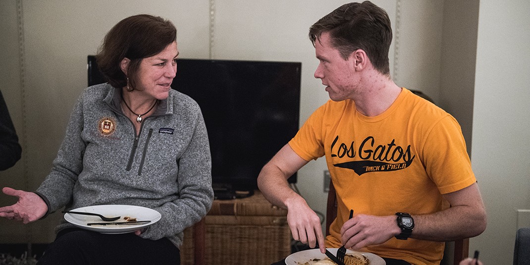 Amy LaCombe chats with a student during Take Home Professor