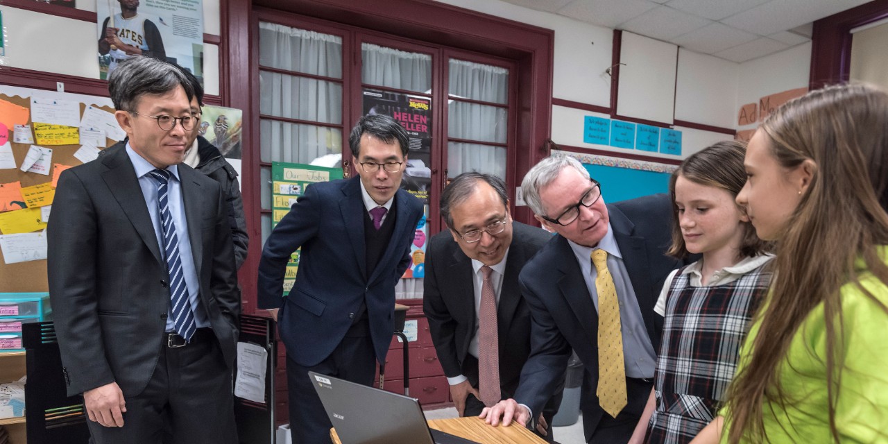 Seoul National University of Education officials meet St. Columbkille Principal Willam Gartside and tour classrooms