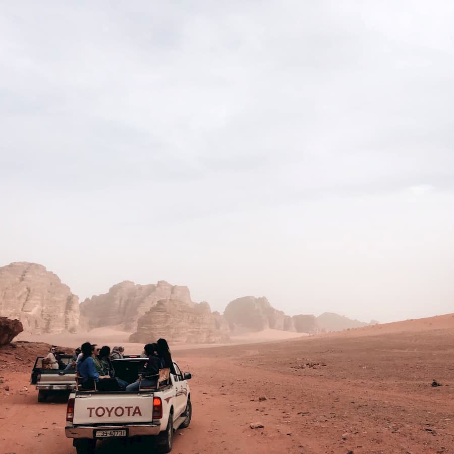 Maddy Van Husen '20 rides through a little sand storm in Wadi Rum, Jordan. One of her favorite memories in Jordan is watching the colors of the rocks and sand change during sunrise.