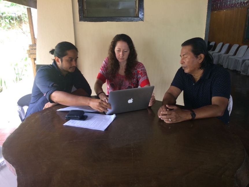 group of people working at a table