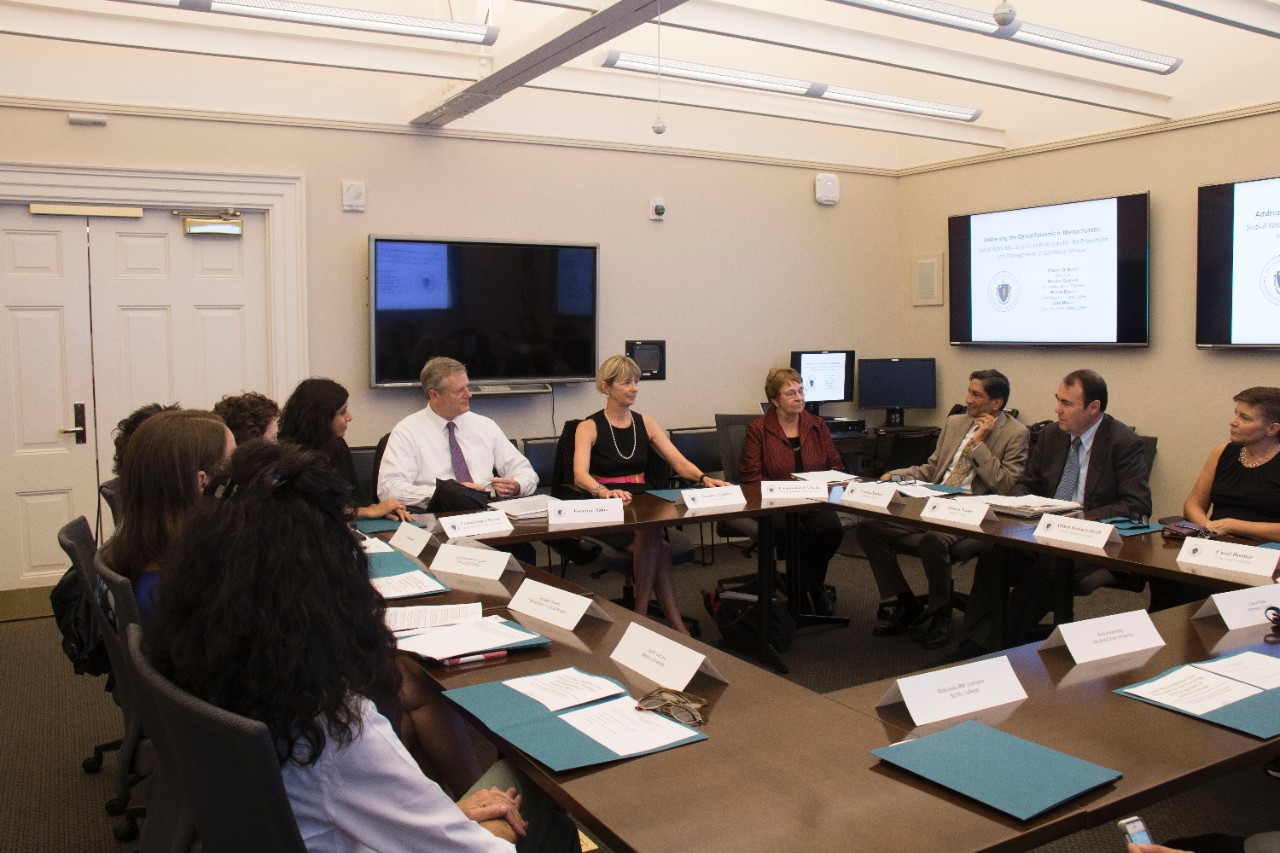 Walsh and Yadama (second & third from right) visit with Governor Charlie Baker, Secretary Marylou Sudders, and representatives from the nine schools of social work in Massachusetts.