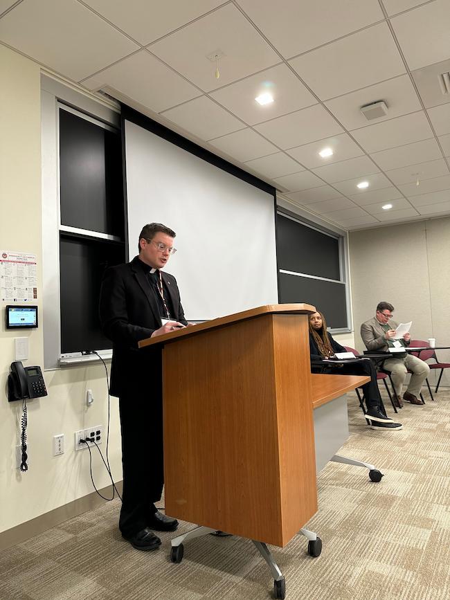 William Woody S.J. presents his paper
