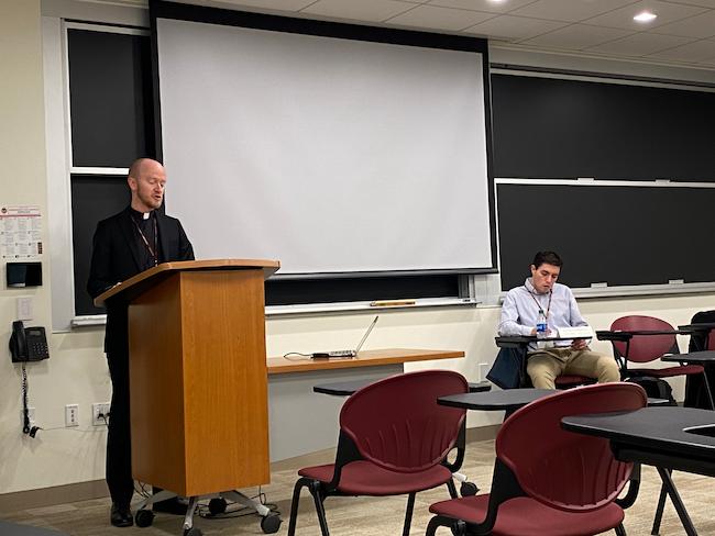 Danny Gustafson SJ delivering his paper with Dennis Wiebolt