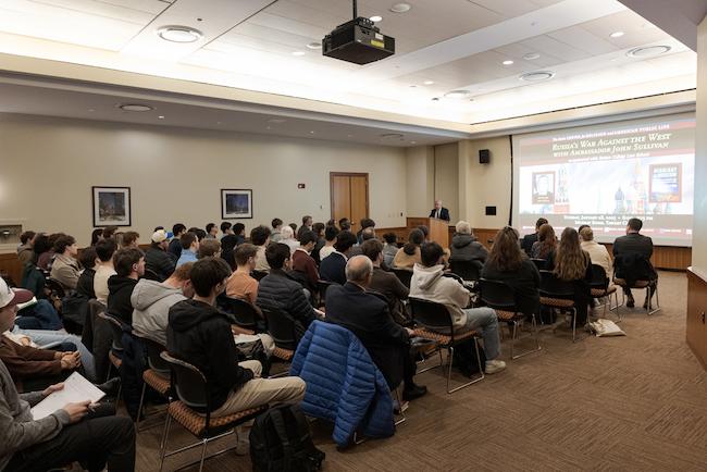 Ambassador John Sullivan delivers his lecture in front of packed audience