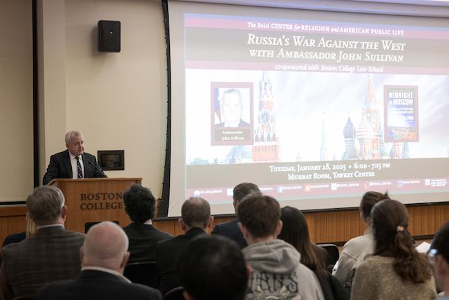 Ambassador John Sullivan at podium