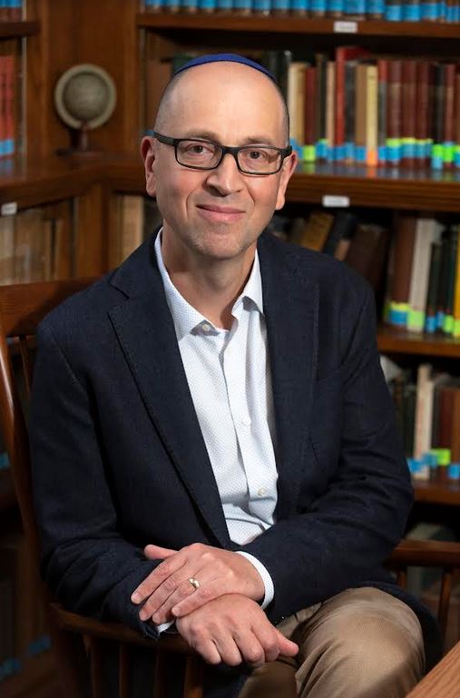 Maxim D. Shrayer in a library