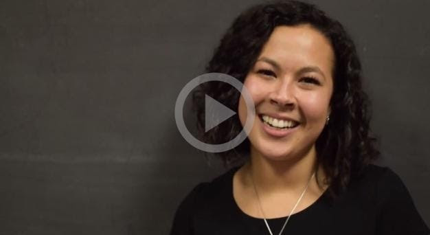 still from a video featuring an alum (Alejandra Trejo '15) speaking against a black background