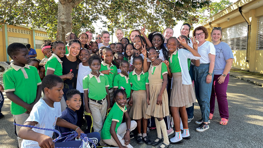 Students and faculty take selfie with students in the Dominican Republic