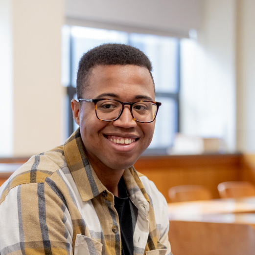 December 12, 2024 -- Boston College Lynch School of Education and Human Development Ph.D. candidate Babatunde Alford participating in a graduate student life holiday craft event, held in Campion Hall 139.