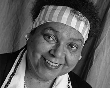 Amanda Houston. Original negative: B-4-52, #31. Former Black Studies Program Director, credited with having fashioned for Black Studies a clear identity and a firm role in the University's curriculum. When she retired at the end of the 1992-93 academic year, Black Studies had grown into a 34-course (now 40) curriculum in African-American history, literature, arts, music and political and social issues.
Passed away on August 24, 1995.
Day by Day:
August 30, 1995
More than 250 colleagues, former students and friends gathered in Gasson 100 to remember former Black Studies Program director Amanda Houston, who died six days earlier. Appointed head of the fledgling program in 1981, Houston over the next 11 years oversaw its expansion into a 34-course curriculum in African-American history, literature, arts, music, and political and social issues.