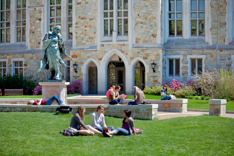 students outside Higgins Hall
