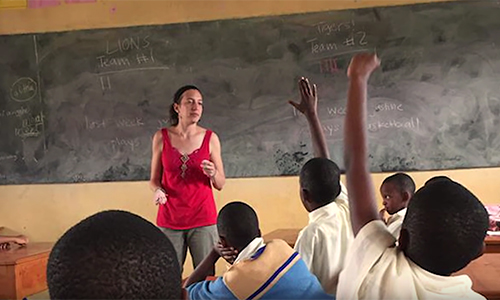 a teacher stands in front of students