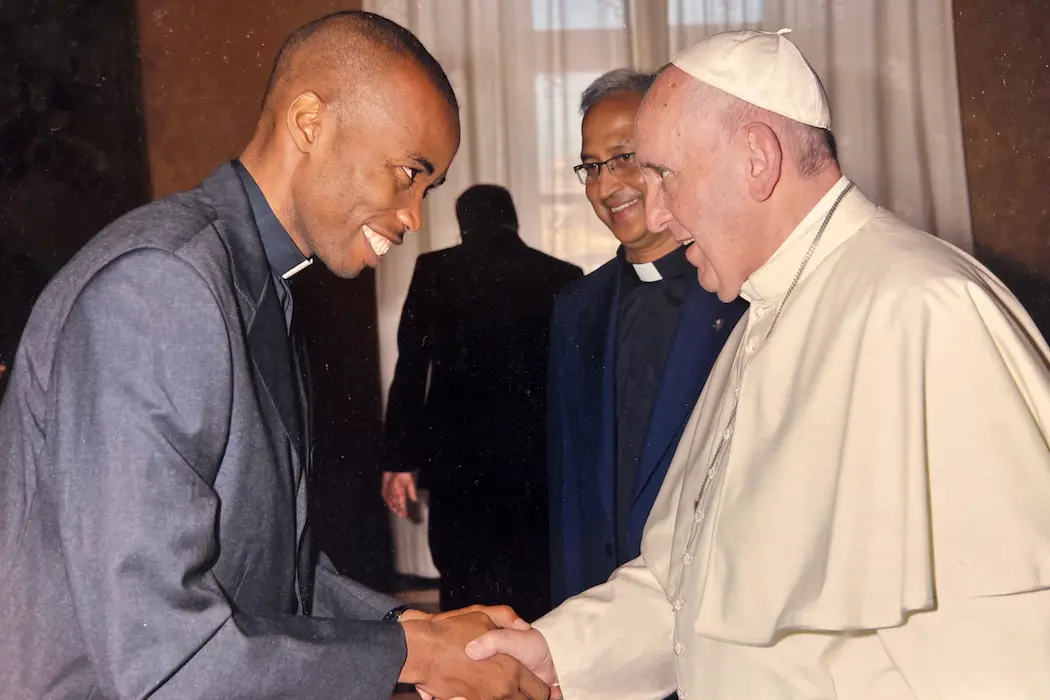 Jude and Pope Francis shaking hands