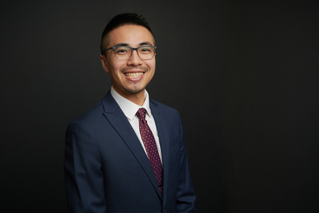 Taiga Guterres poses for a photo in a suit.