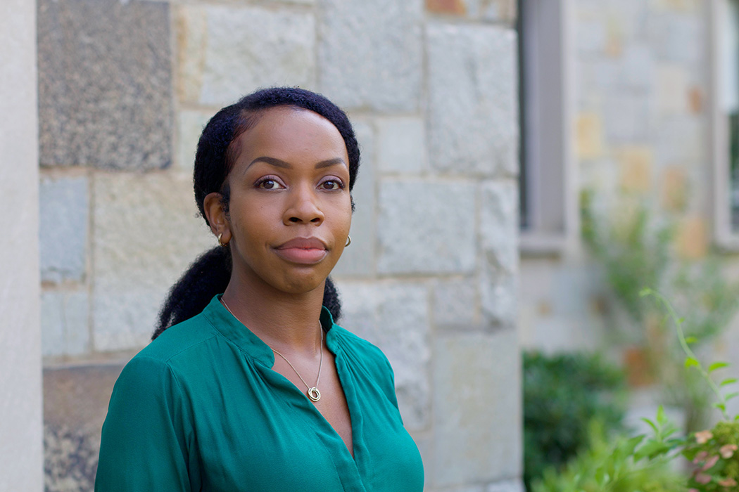 Whitney Irie poses for a photo outside of McGuinn Hall