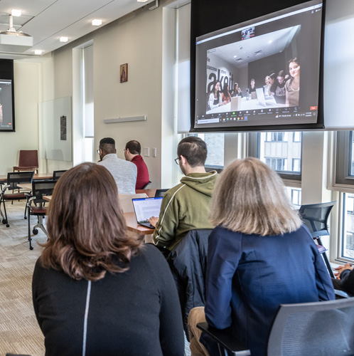 Photo coverage of COP28 Zoom session between BC in Room 501 in 245 Beacon in Chestnut Hill and BC students and faculty members in Dubai. Photographed for the 12/14 issue of Chronicle.