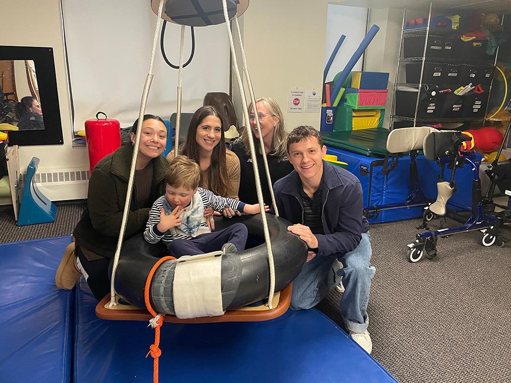 Actor Tom Holland with a student and teachers.