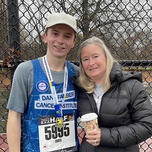 A runner standing with a woman